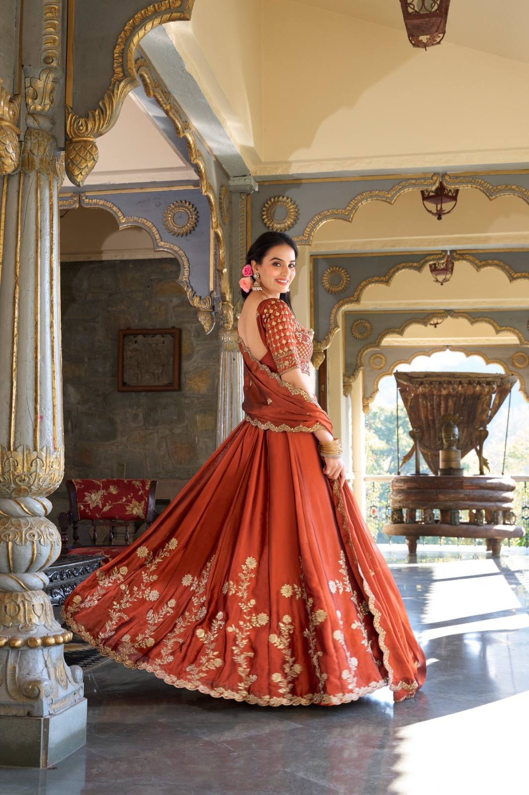 Rust orange rangoli silk lehenga choli with embroidered sequins work